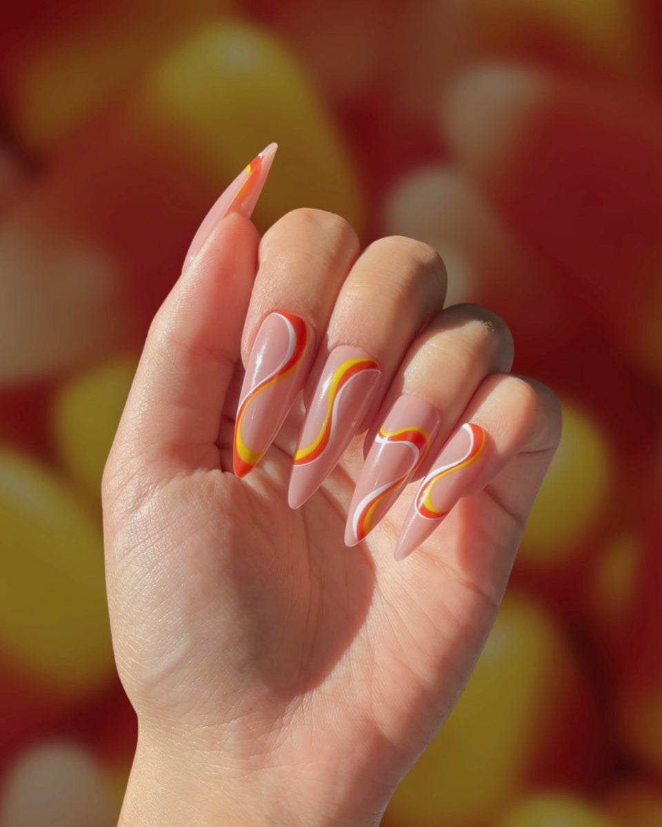 https://pampernailgallery.com/cdn/shop/products/candy-corn-swirl-nails-pampernailgallery_1200x1200.jpg?v=1659699153