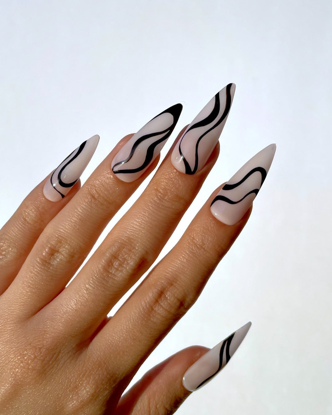 Elegant Swirl-Inspired Glossy Nails
