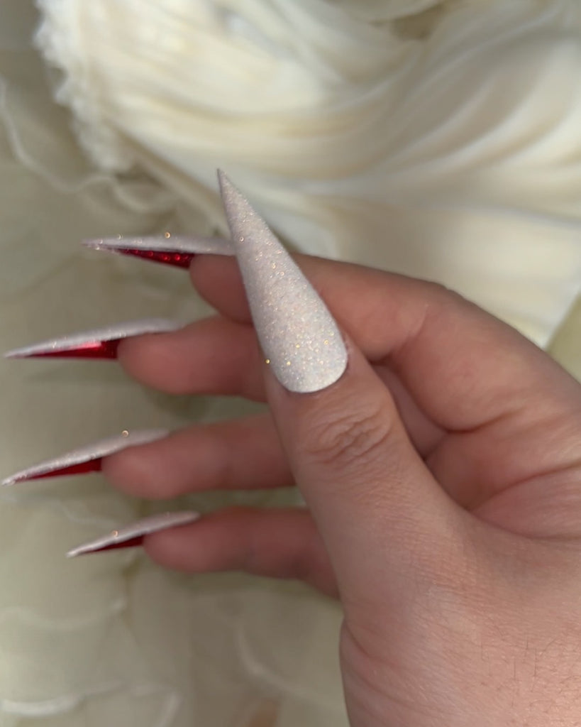 Cupid Wings (Crushed Ruby)-Pamper Nail Gallery-cremé glitter top with flashes of baby blue, champagne, and marigold and a crushed glitter crimson underside